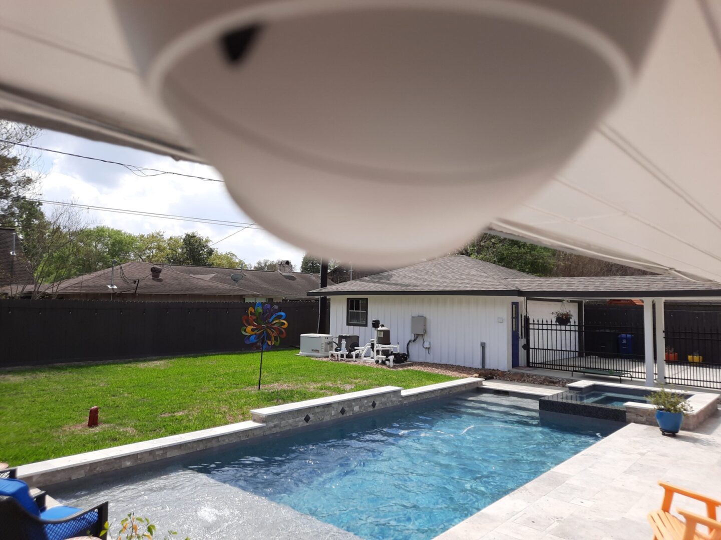 A pool with a white awning over it