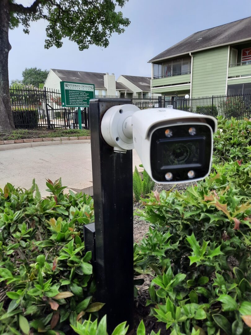 A camera is mounted on the side of a pole.